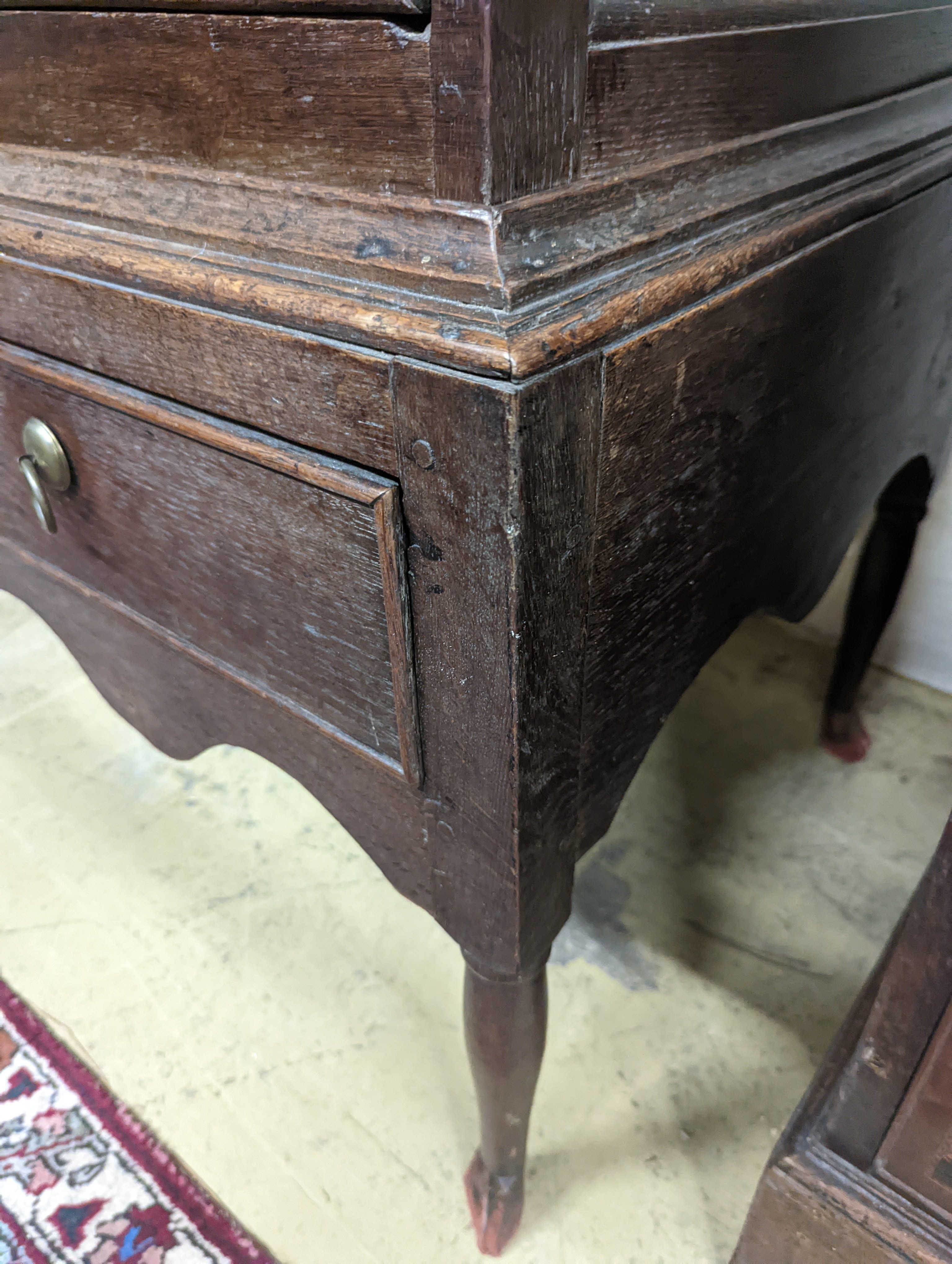 A mid 18th century oak chest on stand, width 89cm, depth 52cm, height 126cm